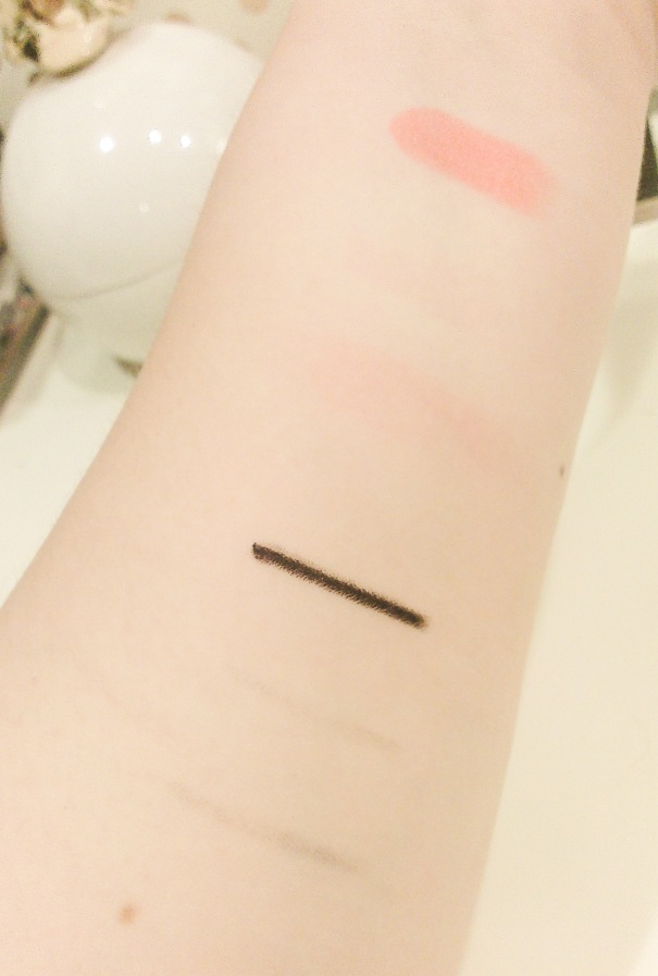 I made 2 sets of test swatches.  For both the lipstick and the pencil eyeliner, the top swatch was left untouched, the second swatch was cleansed with Caudalie, and the bottom swatch was cleansed with Origins toner.